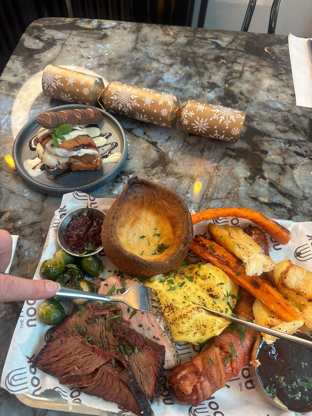 Sunday roast dinner with Yorkshire pudding, roast potatoes and smoked meats at The Nook, Dover